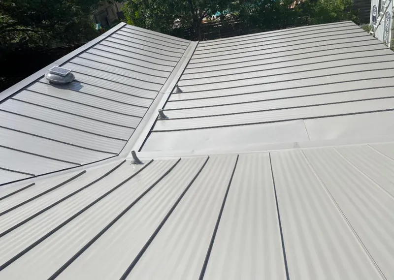 Solar attic fan installed on a metal roof for Roof Ventilation in Port Royal